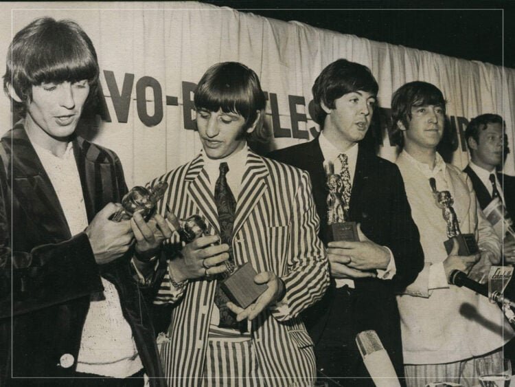 What songs did Elton John write with The Beatles?